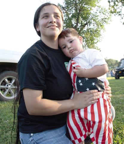 Light up the Sky event held at Kiwanis Park in Baxter Springs was a sea of red, white a blue as residents and visitors gathered to celebrate the nation’s Semiquincentennial. Cohen Moates, in the arms of his mother Josefina Moates, shows off his festive digs.