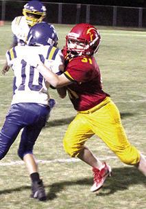 Christian Ellison, pushes the Parsons ball carrier out of bounds in the Central Junior High Seventh Grade game against Parsons, September 22. Columbus will host Girard, Thursday, at Titan Stadium.