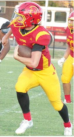 Cole Howard, Titans Junior Quarterback, ran in from 24 yards out for the first six Columbus points in the Titans 33-36 loss in their home opener against Independence, Friday at Titan Stadium .