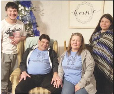 Danny Newcomb (seated, left) and family.