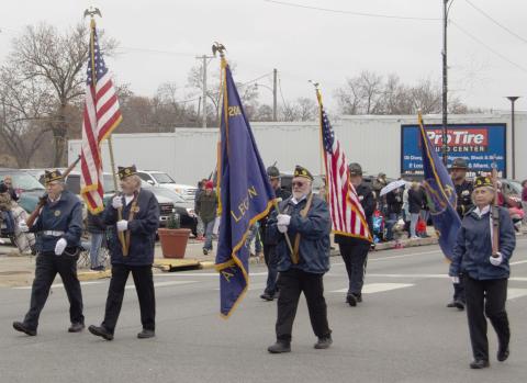 Members of the Baxter Springs American Legion post carried the American and Post Flags at the beginning of the Baxter Springs Christmas parade December 2.
