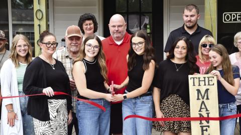 A ribbon cutting and presentation of the first dollar was held at the newest hair salon in Columbus. The Mane Look, was built from the ground up by Columbus High School Alums Hayden and Peyton Allen. They were presented their first dollar (at right) by Rebecca Spooner, Columbus Chamber of Commerce President.