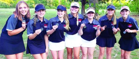 Members of the Lady Titan Varsity and Junior Varsity Golf Teams played a duel tournament at the Country Side Golf Course in Pittsburg, September 26. The varsity squad took second led by Mallory Thompson, sophomore, in first place. Varsity and junior varsity players are: Anna Head, sophomore; Reese Grundy, junior; Paige Patton, freshman; Suzan Crowe, junior; Emily Buffington, freshman; Kenlyn Christiansoen, senior; and Mallory Thompson, sophomore. Courtesy Photo.