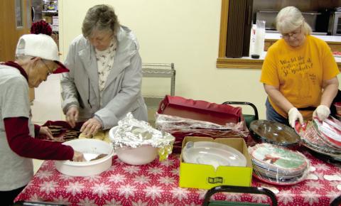 Friday night prior to the St. Bridget’s annual cookie walk, Betty Jansen, Nancy Herrenbruck and Mary Otto readied the serving trays and other necessities for Saturday’s big event. The event was well attended and a large variety of holiday treats were available.