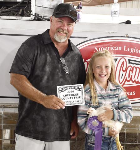 Stetson Danley’s Grand Champion chicken brought in a $650 premium from Puddle Jumpers Liquor Store represented by Rodney Oels.