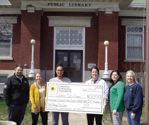 Columbus Public Library received a memorial donation from former Columbus resident Barbara Lee Thomas. Those attending the check presentation included Matt Case, Angie Saporito, Library Lauren Chesner Dainty, Kelly Walters, Jennifer Thompson, Janet Graham. Inset: Barbara Thomas.
