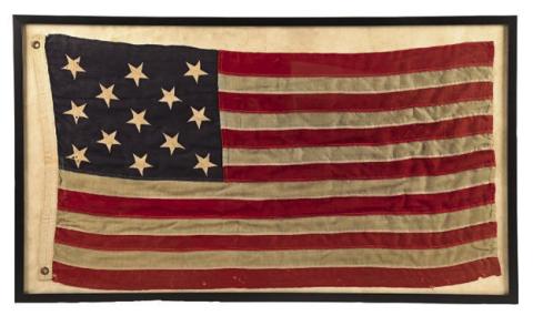 A framed antique American flag features 13 stars, just like the original design approved by the Continental Congress.Photo Credit: Morphy Auctions (c) 2026 by Cowles Syndicate Inc.