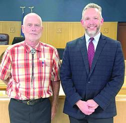 County Chairman Greg Walker stood next to County Attorney elect Kurt Benecke a few minutes after the GOP Committee Men and Women voted him as their choice to replace Nathan Coleman.