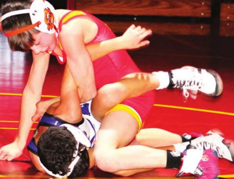 Mini Titans exhibit on varsity mats