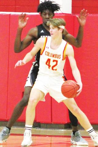 Titan Sophomore, Seth Stover, works against 6’11” Frontenac Junior, Jordan Fudge, under the basket during the Titan Varsity loss to the Raiders, 54-47, Friday night at the CUHS Gymnasium.