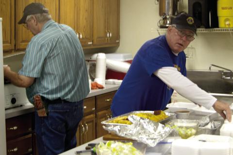 Lions Club members Brad Gleason and Mark Winter were busy preparing the meal served at the Lions Club vegetable soup and bean feed. The event was held at the St. Rose Parish Hall on Thursday at noon and evening.