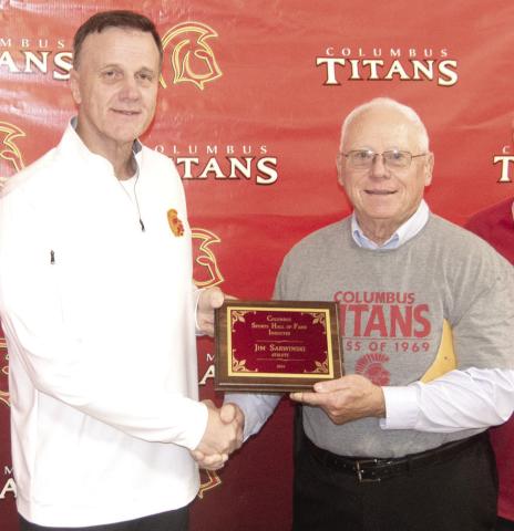 Hall of Fame Chairman Kerry Sachetta presented inductee Jim Sarwinski his plaque during the ceremony.