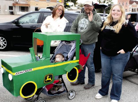 “Nothing runs like a Deere”, even during the Halloween Walk in Columbus. Ally Wells’ stroller was decorated just like a John Deere Tractor. Her youngster was enjoying his time in the driver’s seat.