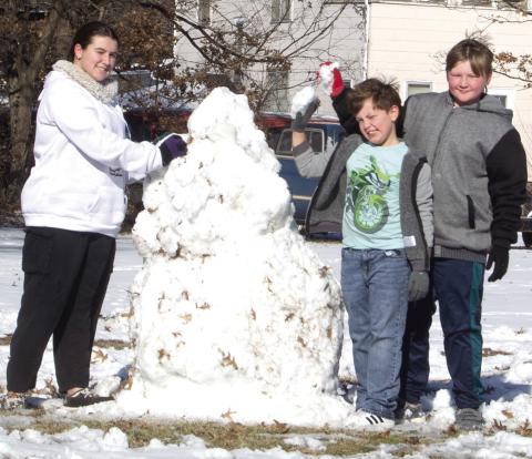 With the weekend snow came snowmen. Three youngsters built two snowmen on Maple Avenue Saturday. They are Zoey Clark, Brodie Robinson and Sully Clark.