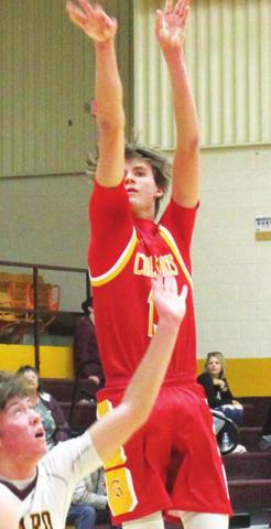 Titan Junior, Kolt Ungerheuer, shots for three in the, 52-58, Columbus loss to the Trojans in Girard, Tuesday. Kolt led the Titans with 16 points.