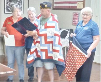 A Quilt of Valor was presented to Sgt. Christopher Moss August 19 at the Baxter Springs American Legion. Moss served in the United States Army from 20082018. He had several duty stations, including Afghanistan for a year in Sharama driving supply trucks for route clearance, then served with the Special Forces for the rest of his tour. Courtesy photo.