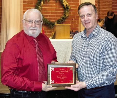 Paul Jaeger was inducted into the Columbus Sports Hall of Fame and presented a plaque by Kerry Sachetta to commemorate his joining other outstanding athletes.