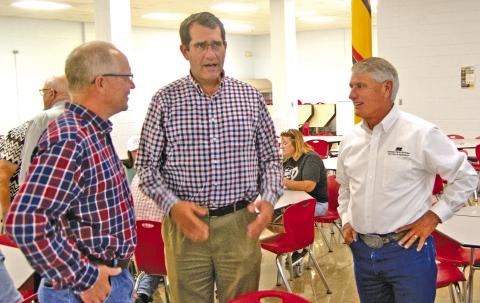 State Representative Dale Helwig talked with U.S. Representative Derek Schmidt and Farm Bureau executive Joe Newland at the Cherokee County Farm Bureau annual meeting on Monday evening.