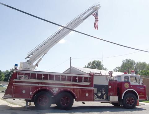 The Hot Rod and Hoses week-end at Scammon featured this West Mineral ladder truck holding the American Flag over the car show. The Saturday event had a big turnout.