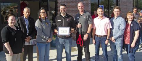 The Grand opening of American Bank was a huge success as dozens of people attended the ribbon cutting. Bank employees and officers were on hand for the event. The Chamber of Commerce presented the bank with a plaque. Attending the opening were Lindsey Morris, G. Lynn Mitchelson, Mandy Hudson, Taylor Hight, Jim Gaither, Andy Bingham, Bob Sell and Crystal Alford.