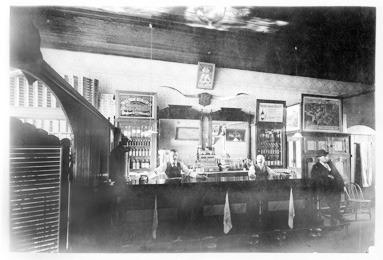 Early saloons could be very plain or very elaborate, with the latter often serving as a meeting hall or a place to receive mail, use a toilet, or read a newspaper. Courtesy Kansas Historical Society