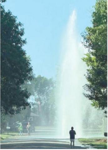 A major water leak erupted in Baxter Springs Saturday. Two breaks left many in the south end of town without water for several hours. Courtesy photo.