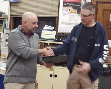 Columbus Post Master Tyler Speer presented long time postal carrier Martin White with a certificate recognizing his years of service and celebrating his retirement. White began in 1997 as a temporary substitute rural carrier. White has spent his entire career in Columbus. Courtesy photo.