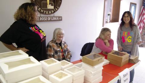 The annual Dream Big Little Ones fund raiser on Sunday was a busy place. The starting place was busy as the volunteers unfolded the boxes and assisted the cookie buyers