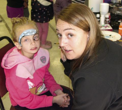 Gracie Eisenhour was getting her face painted by Michelle McCormick during the Family Fall Festival in Scammon on Saturday. It was an afternoon of fun, food and entertainment.