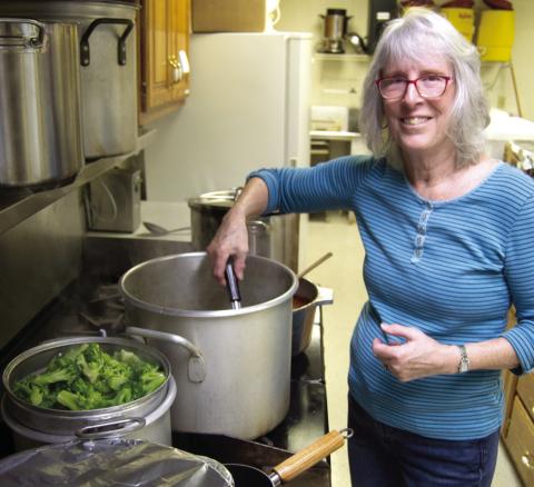 Ena Smittle was preparing the toppings, including steamed broccoli, for the PEO baked potato fundraiser Wednesday.