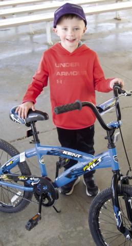 Jaxson Harper, 9, of Columbus found the lucky egg that gave him a new bicycle for Easter. A large turnout of the various age groups filled the City Park with.