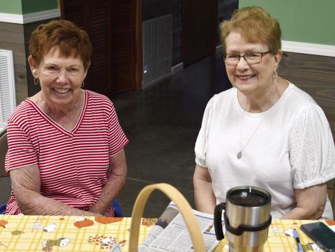 Always willing to lend a helping hand at local fundraisers, Myrna Martin and Lorna Stover were among those helping out the event for Jim Bowles and Sandy Louthan.
