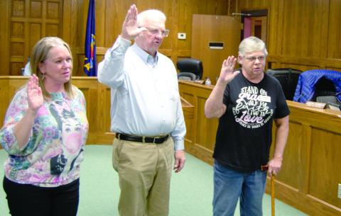 Newly elected Columbus City Council member Laura Epler (left) was sworn into to her Ward 1 position on Tuesday evening by City Clerk Ruth Hutley. Former City Council members Tom Pryor and Kathy Doherty were also sworn in by Hutley as they returned to office.