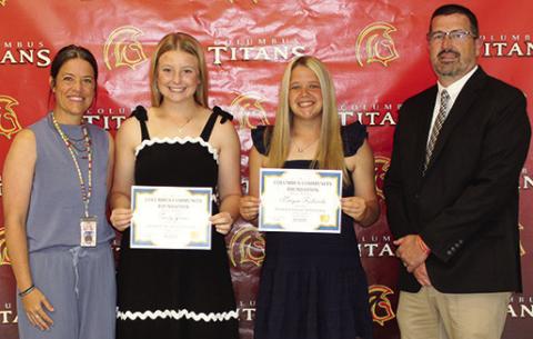 Trinity Green and Morgan Richards received the Sandra B. Houser Memorial Scholarship in the amount of $1,000 each from CACF Board Member, Kelly Walters and USD 493 Superintendent Dan Grundy during the Senior Assembly, May 15, at the Columbus Unified High School Gymnasium.