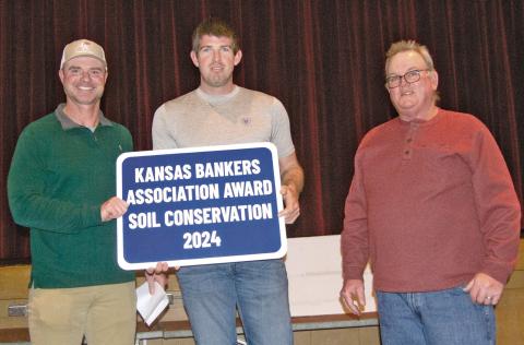 Kansas Bankers Association Key Banker Jim Gaither presented the Cherokee County Kansas Bankers Conservation Award to Crey Brake for his conservation efforts on his farm south of McCune. The award was presented during the County Conservation Dinner on Monday evening.