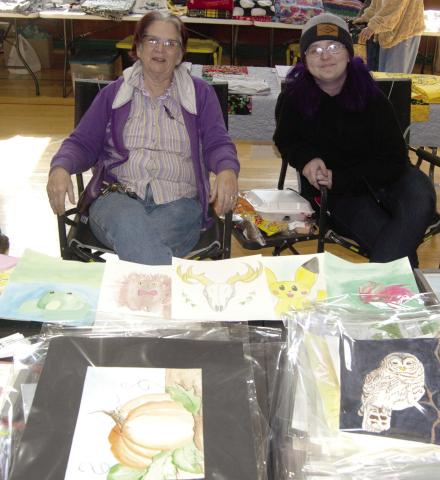 Framed and unframed artwork by Karen Hardessey aand Tabatha Sublertte were among the popular and creative items at the Pecan Festival as it returns to Chetopa