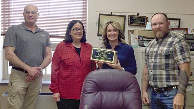 Cherokee County Commissioners Myra Carlisle Frazier, Lorie Johnson and Cory Moates accepted a first place award for exceptional loss ratio’s from KWORC loss prevention specialist and marketing director Jes Pfannenstiel at an April meeting.