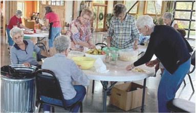 Members of Columbus First Christian Church gather each fall to cut and peel bushels of apples to make their famous pies. Beverly Rahmeier, Geneva Grubbs, Lorna Stover, Retha Schultz and Colleen Johnson were hard at work peeling and slicing. Courtesy photo