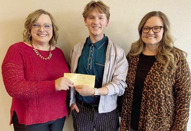 Southeast High School graduate Peyton Simpson (center) had the winning logo design for Labette Community College’s 100th anniversary. Simpson is also a graduate of LCC’s Graphic Design Technology program. Lindi Forbes, Foundation and Alumni Director (left) and Melissa Kipp, Professor of Graphic Design (right) presented Simpson with his award. Courtesy photo.