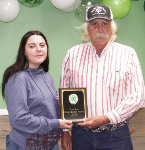 Airaunana Sharp presented the annual 4-H Buddy Baker Award to Jerry Seely. This award goes to someone who has taken an active role in supporting 4-H and the Cherokee County Fair in the last few years. He is an active bidder at the dessert auction and has sponsored awards.
