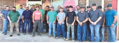 Thursday morning, 20 employees of Crossland Heavy unloaded and stacked 125 new twin mattresses for Dream Big Little One. Courtesy photo.
