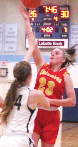 Lady Titan Sophomore, Katie Simpson, shoots over Lady Cougar sophomore, Maddy Conlin, during the first round Columbus win, 43-40, in the Lancer Classic, Monday, at Southeast High School.