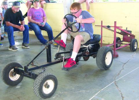 During the annual Pedal Tractor Pull, younger children get to try their hand at a smaller tractor, while older youngsters try their hand at this one. Winners in each division have the opportunity to compete at the Kansas State Fair.