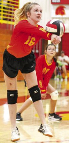 Seventh Grader, Kensley Blackledge, returns a hit during recent Columbus matches at the CUHS Gymnasium. Awaiting the result is Madison Duling in the background.