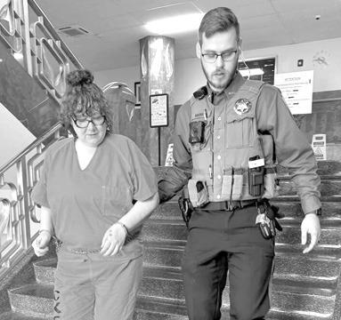 Megan VonHemel escorted by Deputy Evan Duckett after being sentenced to prison for six and one half years. VonHemel pleaded guilty to charges of aggravated battery, abuse of a child and interfering with law enforcement. Courtesy photo.