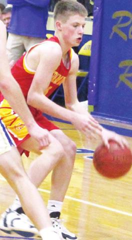 Titan Freshman Jace Midgett, dribbles round his Ram defender in the junior varsity loss at Riverton.