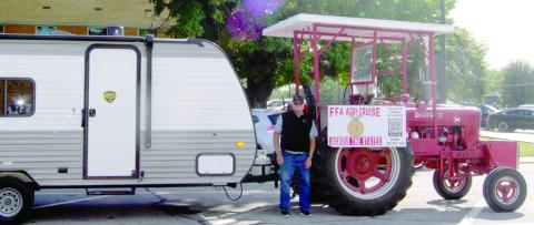 Traveling from Canada to Mexico on a 1940 Farmall M tractor Mark Koehn stopped briefly in Columbus. This marks the halfway point in his 2,000 mile trip.