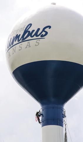 Workmen were finishing the work on the water tower in Columbus City Park. The iconic ships have been replaced with the city’s official logo. The decision for the change was made at the April 6 Columbus City Council meeting.