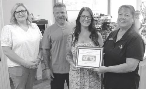 The “First Dollar” plaque was presented to Jennifer Reid, florist and Nate and Casey Long, owners of Life in Bloom and Co. by Sonja Duley at the recent ribbon cutting and open house held Friday. Life in Bloom and Co. sells fresh cut flowers, live plants and gift items. They also feature a coffee bar offering a variety of specialty drinks.