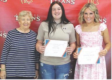 Kadi Cobb and Kenadie Carter received the Mercy Hospital Auxiliary Scholarship in the amount of $300 each from Lucille McNemar during the 2025 Senior Assembly, May 16, at the Columbus Unified High School Gymnasium.
